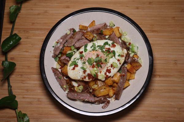 Steak, chorizo and potato hash with egg